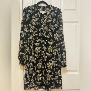 Shirtdress. It features a V-neckline and lightly puffed shoulders.